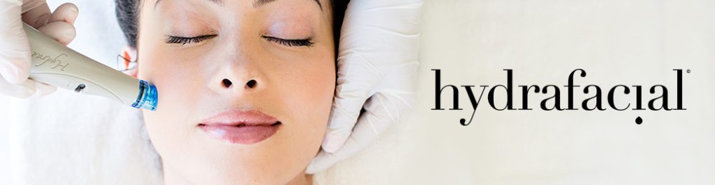 A happy lady getting her Hydrafacial treatment at Oceren.